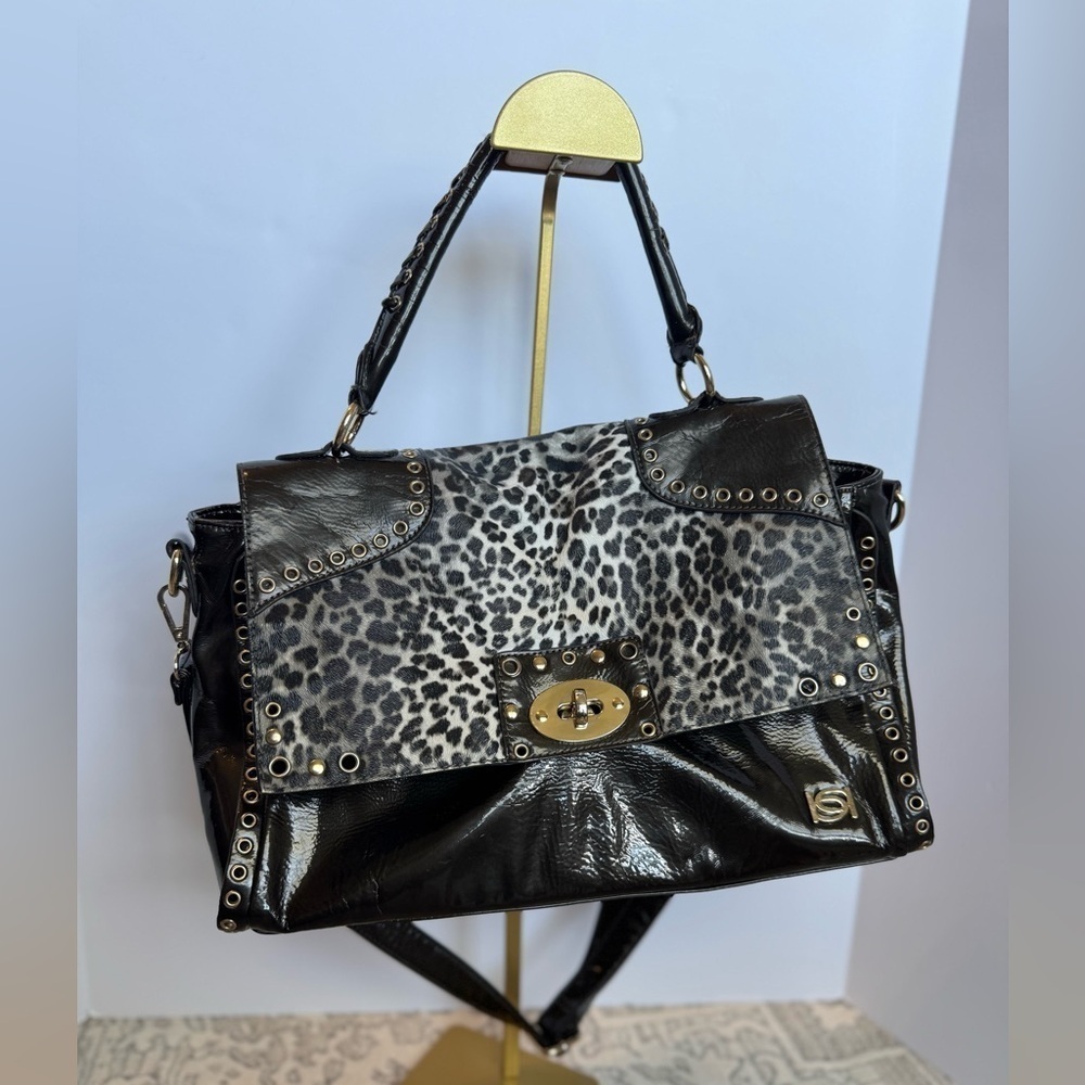 BEBE Large Handbag Leopard Grommet in Black and gray and gold
